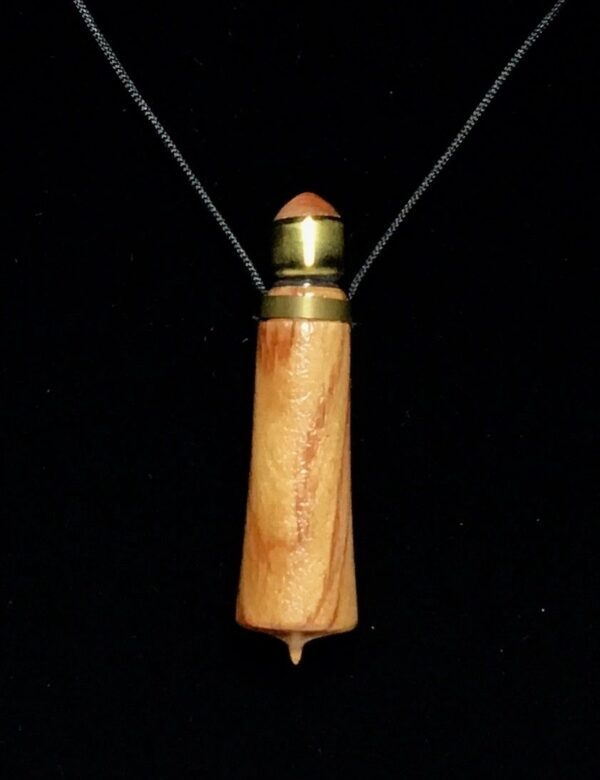 A wooden necklace with a bullet casing on it.