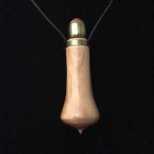 A wooden bullet necklace with a black cord.