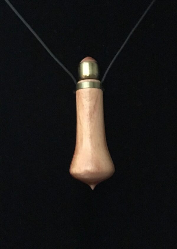 A wooden bullet necklace with a black cord.