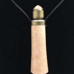 A wooden necklace with a gold cap on it.