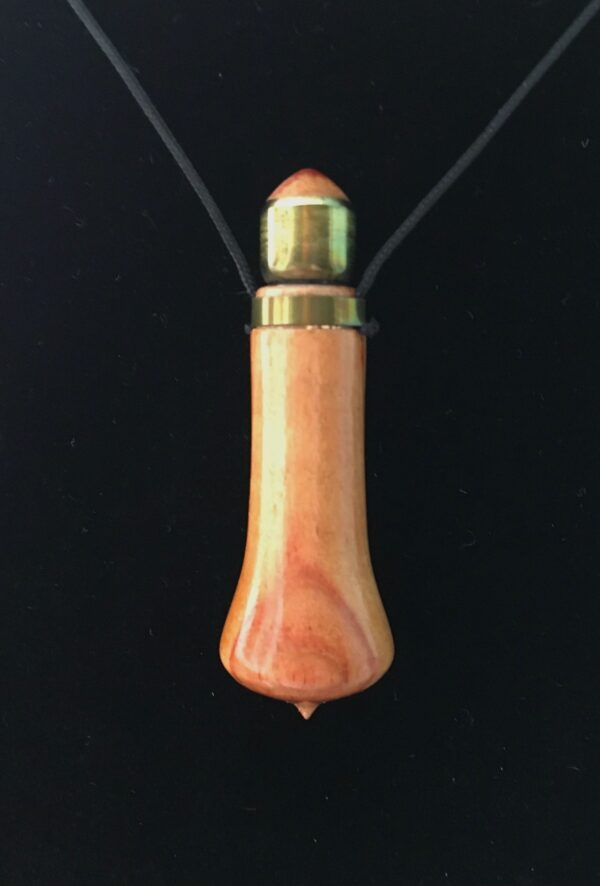 A wooden bullet necklace with a black cord.