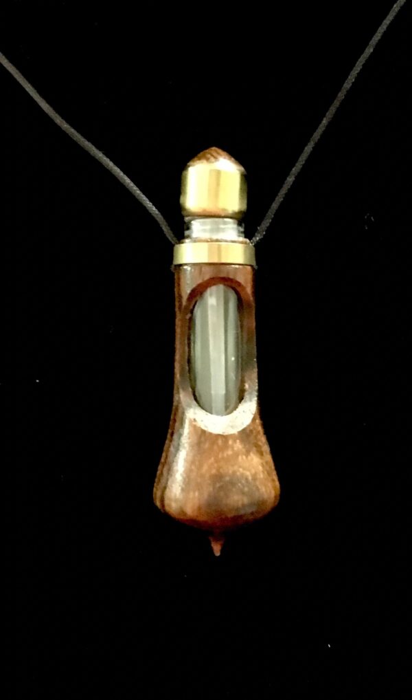 A wooden necklace with a glass pendant.