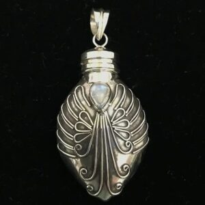 A silver pendant with an angel wing design.